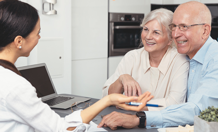 Senior couple planning their investments with financial advisor