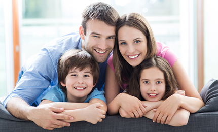 Family relaxing on sofa